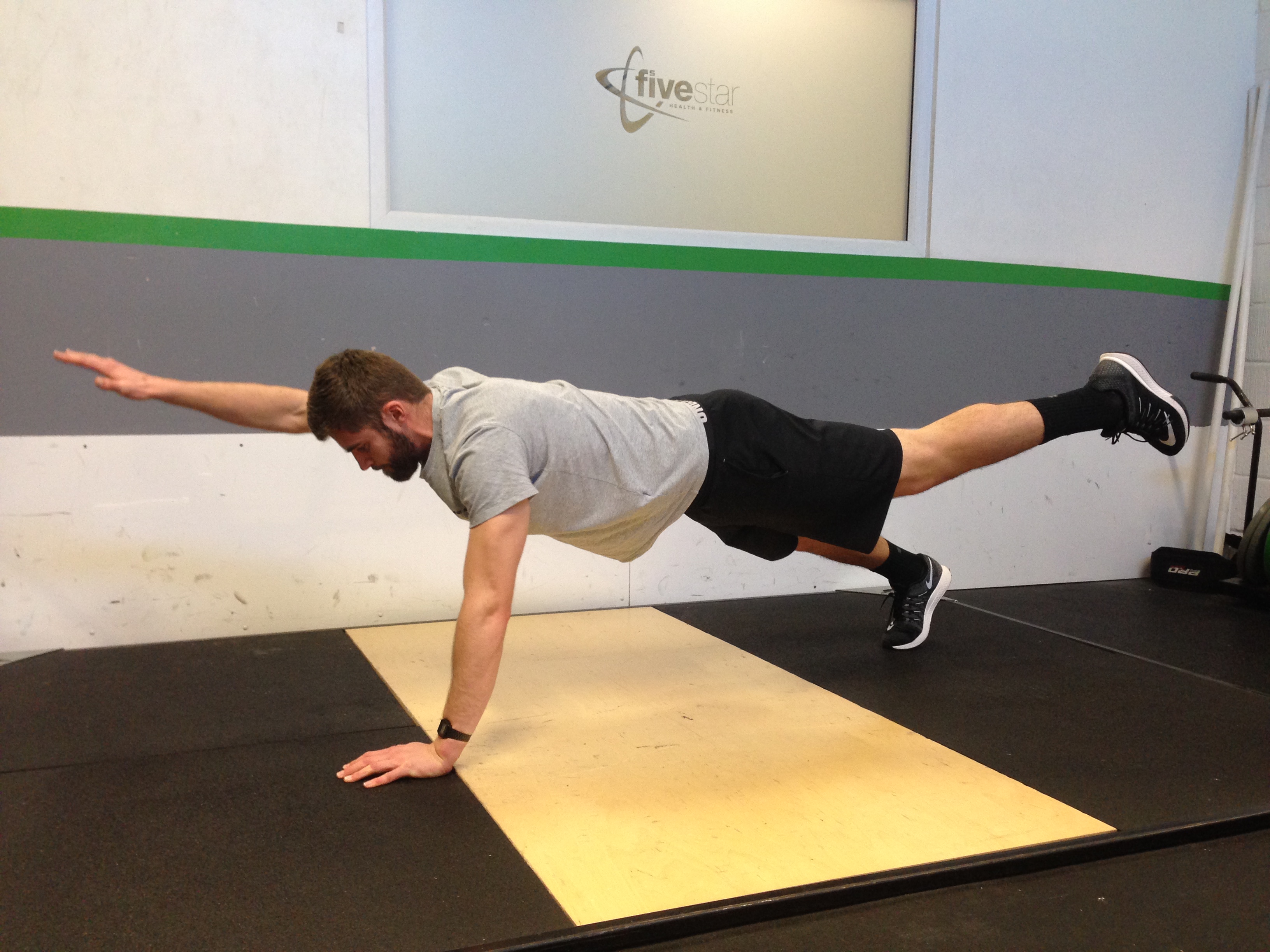 Man performing a push up to get fit at home