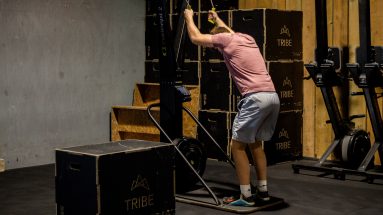 Male using Concept 2 Ergometer for exercise, which is important to lose body fat